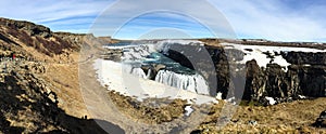 Gullfoss waterfall, rainbow, blue sky, Iceland, panorama