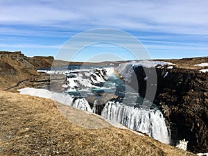 Gullfoss waterfall, rainbow, blue sky, Iceland