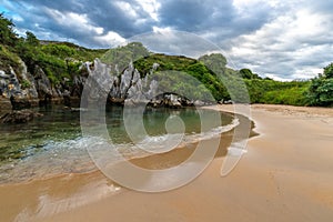 Gulpiyuri beach, inland beach located near Llanes, Asturias, Spain photo