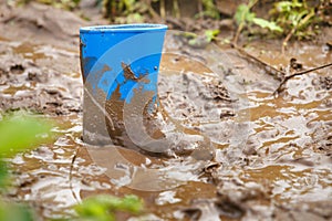 Gum boot stuck in dirt