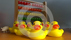 Gum rubber ducklings and other toys on the table.