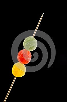 Gumdrops on skewer, Colorful Fruit Sugarcoated Marmalade balls. Traditional Scandinavian Christmas Candy photo