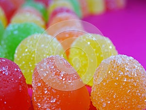 Gummies candy on a ondulated pattern closeup