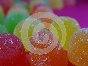 Gummies candy on a ondulated pattern closeup