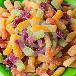 Gummy candy two-color red and green close-up, multi-colored gummy worms