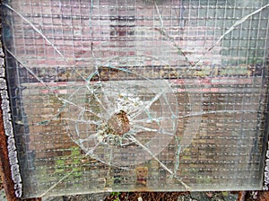 Gun bullet broken window glass