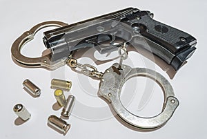 Gun, bullets and handcuffs