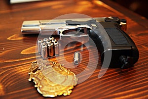 Gun, bullets and police badge