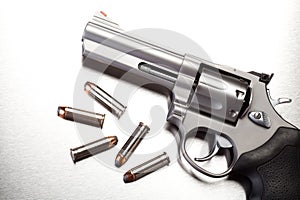 Gun with bullets on steel