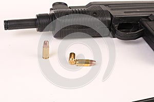 Gun and bullets on a white background