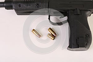 Gun and bullets on a white background