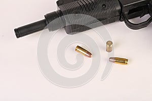 Gun and bullets on a white background