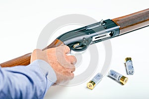 Gun control or home defense concept. Hand of male and rifle