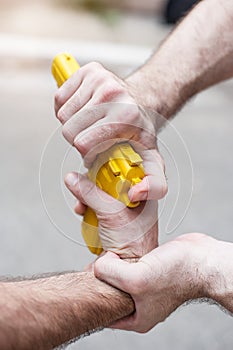 Gun Disarm. Self defense techniques against a gun point.