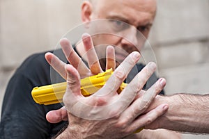 Gun Disarm. Self defense techniques against a gun point.