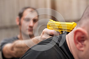 Gun Disarm. Self defense techniques against a gun point.