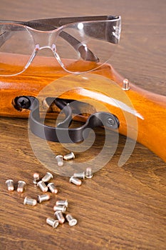 Gun, a few bullets and glasses