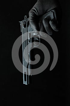 Gun and a Hand on a Black