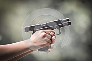 The gun in the hand while firing