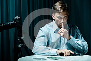 Gun and money on table