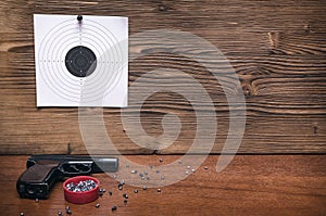 Gun and paper target. Shooting practice. Shooting range.