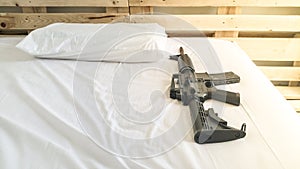 gun Put on a comfortable mattress and pillow white .
