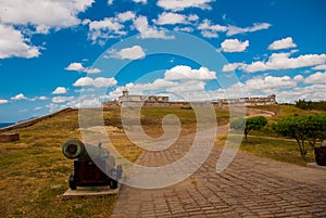 Gun at the road entrance to the old fortress. Castle San Pedro de la Roca del Morro, Santiago de Cuba, Cuba, Castle San Pedro de l