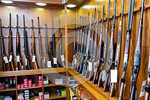 Gun store interior with rifles on showcase