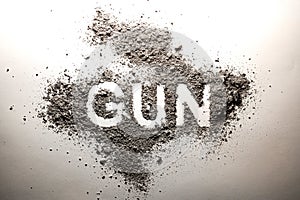 Gun word written in ash as crime, criminal, violence, murder, de