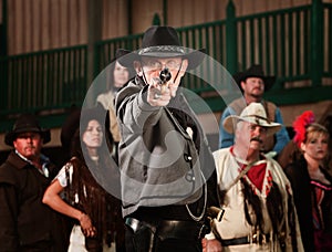 Gunfighter points gun at camera