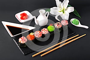 Gunkan sushi set with salmon, tuna, perch, eel, scallop, caviar, shrimp, sharp. Traditional Japanese cuisine.