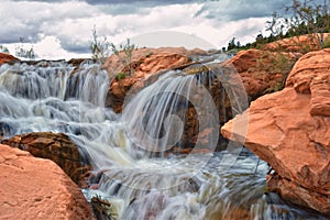 Gunlock Falls State Park Reservoir waterfall views, Utah by St George. 2023 record snowpack spring run off