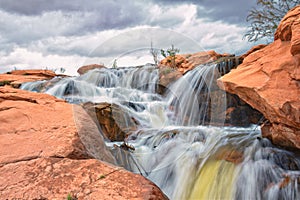 Gunlock Falls State Park Reservoir waterfall views, Utah by St George. 2023 record snowpack spring run off