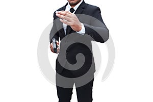 A gunman in a black suit holds a pistol with his other hand up to cover the target. white background Concept of