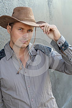 Gunman in the old wild west close up saluting with the hat