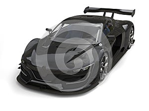 Gunmetal black super car - top down studio shot