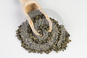 Gunpowder green tea in scoop