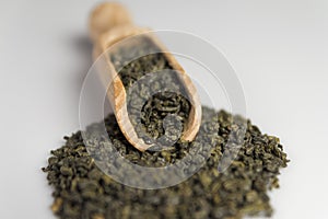 Gunpowder green tea in scoop