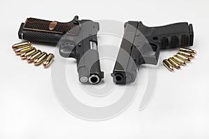 Guns and bullets , Semi automatic pistol handguns with ammunitions on white isolated background