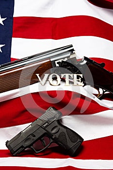 Guns with the letters vote in front of the American flag, vertical