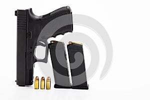 Guns , Semi automatic pistol handgun and 9 mm. bullet magazines on white background