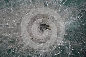 Gunshot marks on bulletproof glass