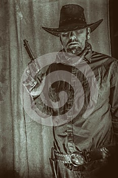 Gunslinger Old West Cowboy Holding up Gun Western photo