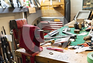 Gunsmithing tools on a working table at a gun shop