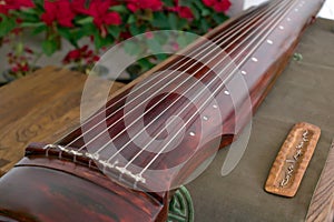 Guqin, a seven-stringed plucked instrument in some photo