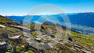 Gurglitzen - Idyllic hiking trail on alpine meadow with scenic view of lake Millstatt seen from mountain peak Boese Nase