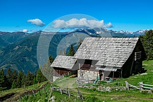 Gurglitzen - Wooden cottage with panoramic view of majestic mountain peaks of Carnic and Julian Alps. Idyllic hiking trail