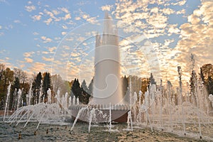 The gush of water of a fountain.