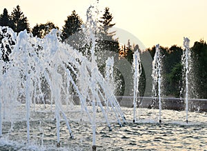 The gush of water of a fountain.