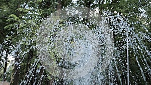 The gush of water of a fountain. Splash of water in the fountain